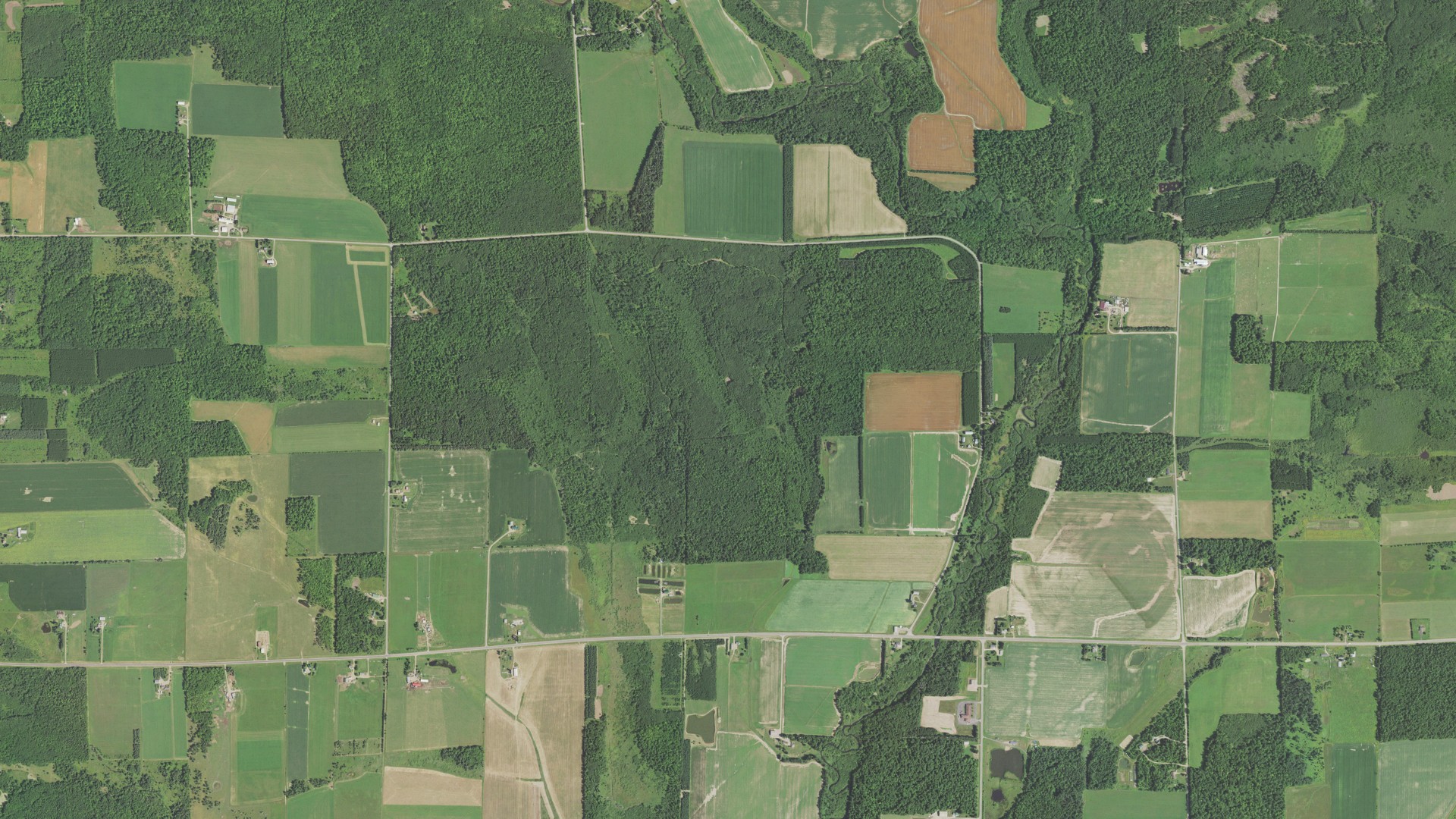 Natural-color aerial photograph of land around Peck, Wisconsin
