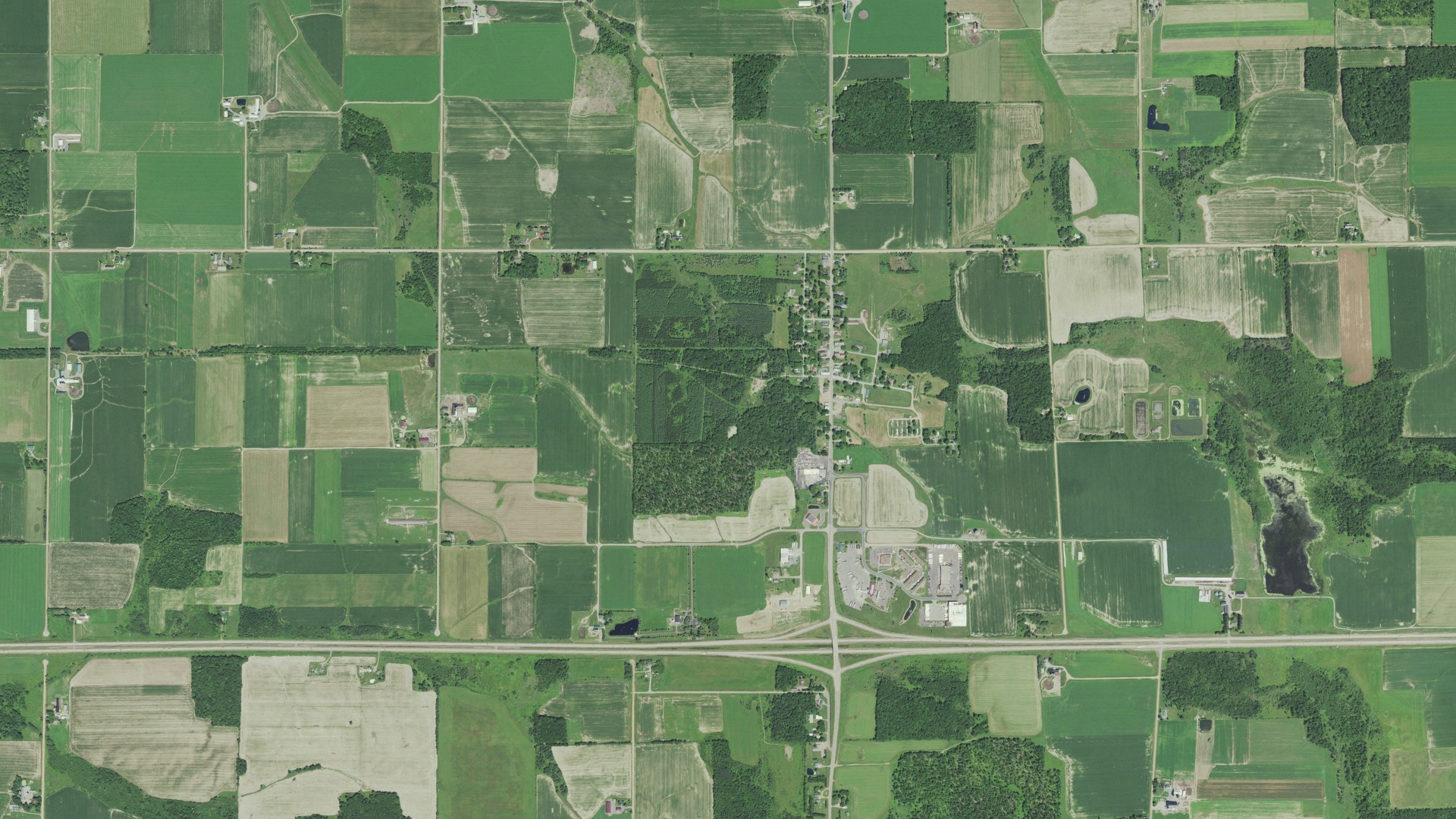 Natural-color aerial photograph of land around Curtiss, Wisconsin