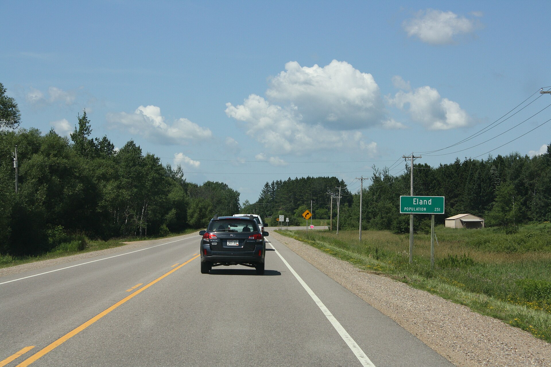 Looking west at the sign for w:Eland, Wisconsin on w:U.S. Route 45. This file was uploaded with Commonist.