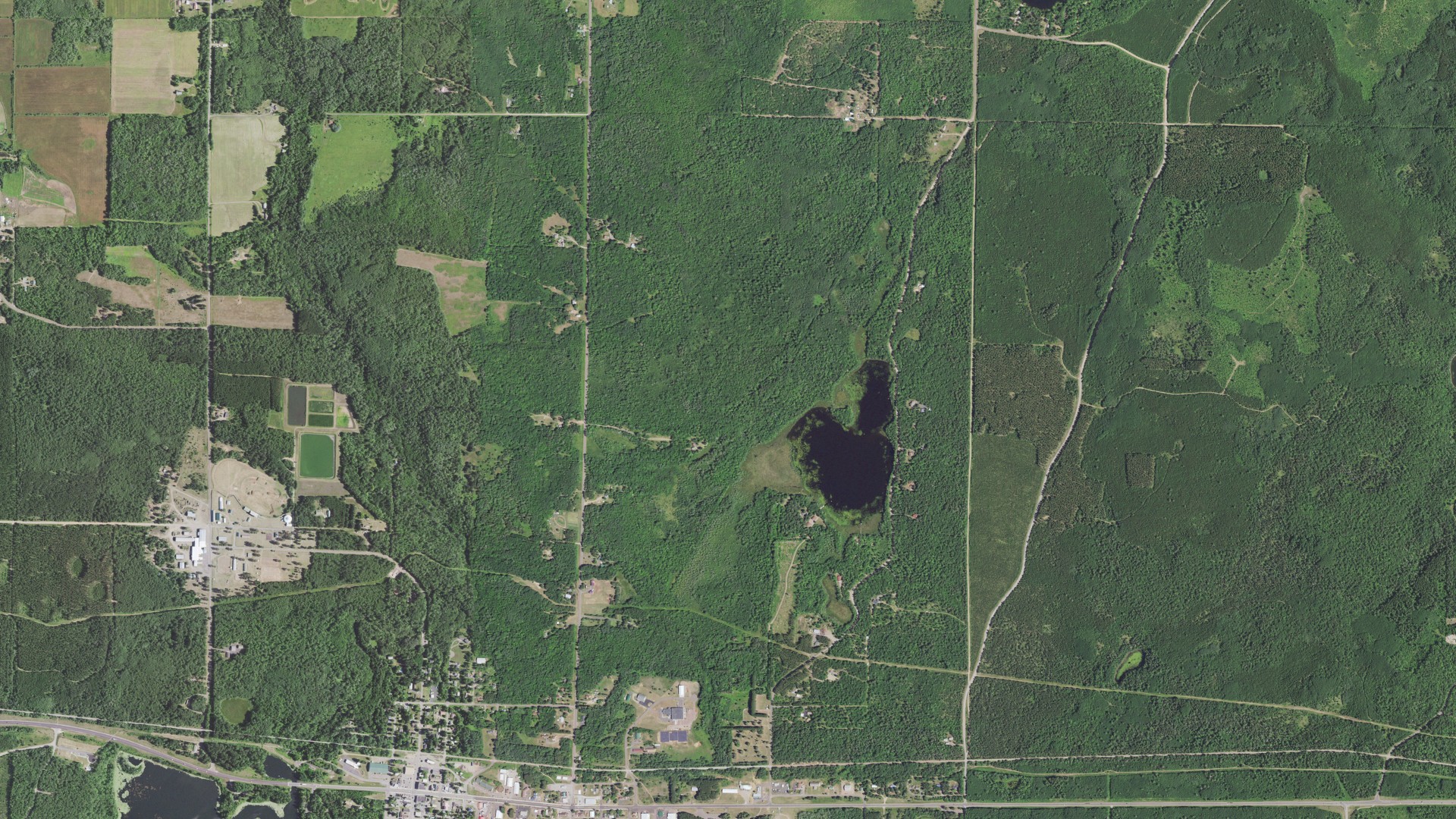Natural-color aerial photograph of land around Iron River, Wisconsin