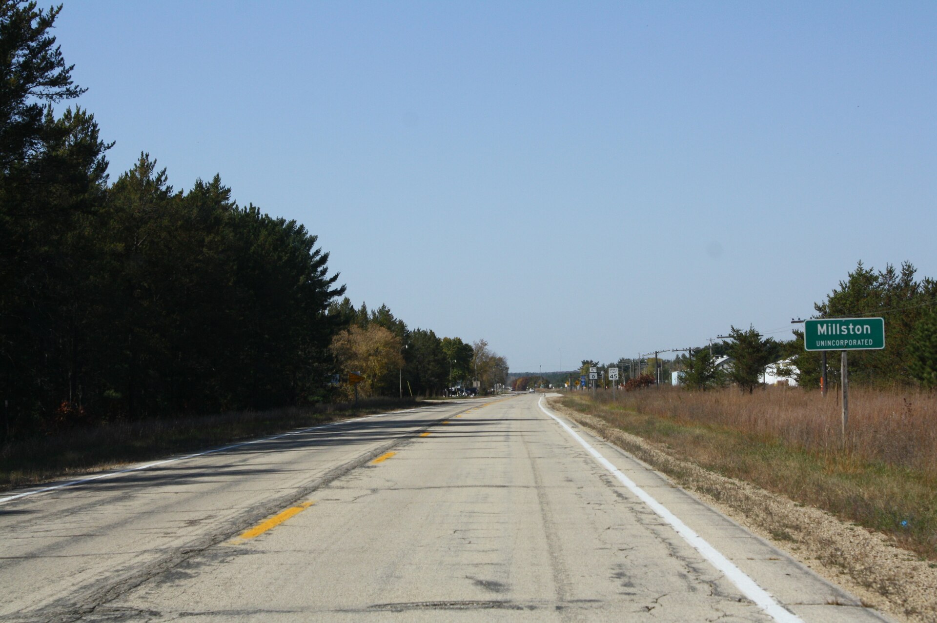 The sign for w:Millston, Wisconsin on w:U.S. Route 12. It is part of the Robinson Creek Pines State Natural Area. This file was uploaded with Commonist.