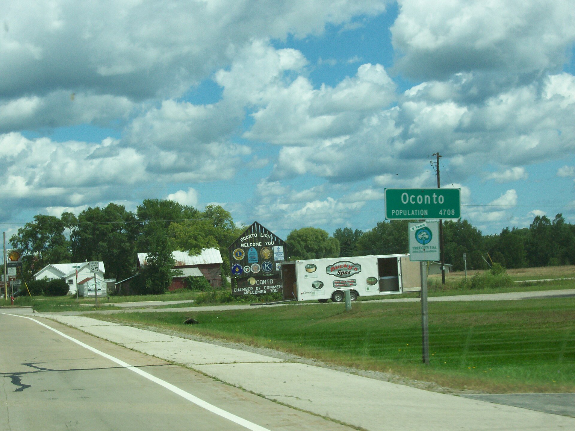 The DOT and welcome signs for Oconto, Wisconsin, USA. Looking north on U.S. Route 41.