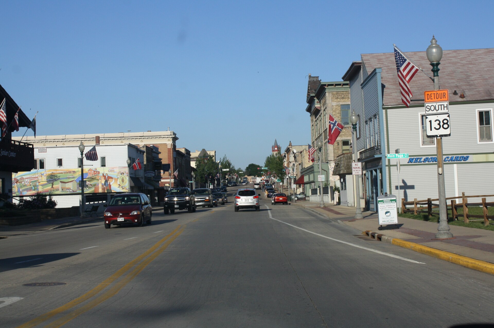 Looking east at downtown w:Stoughton, Wisconsin on w:U.S. Route 51. It is listed as a historic district called the w:Stoughton Main Street Commercial Historic District.