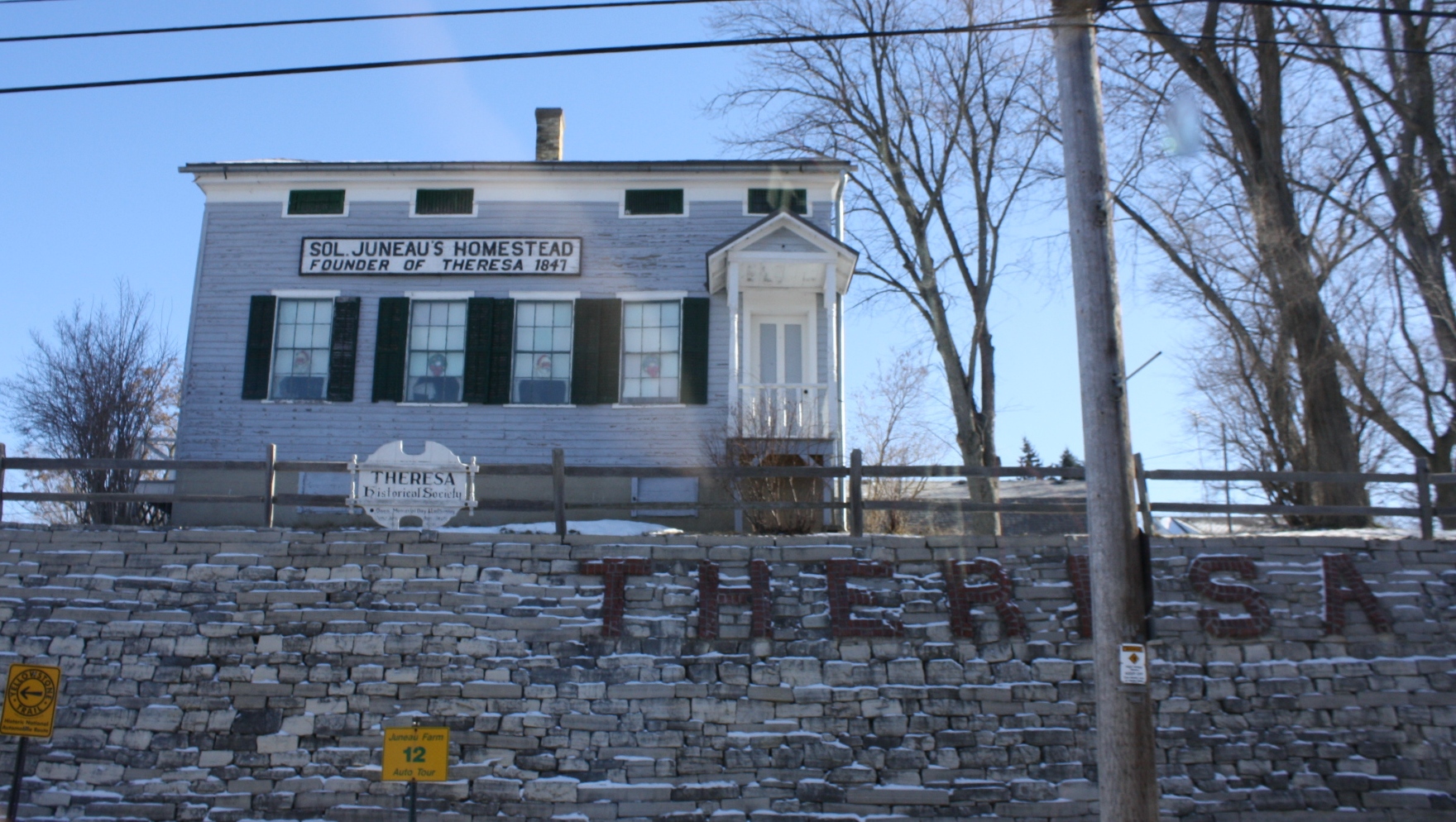 The home of Solomon Juneau, the founder of w:Theresa, Wisconsin. It now houses the Theresa Historical Society. It is located on the w:Yellowstone Trail.