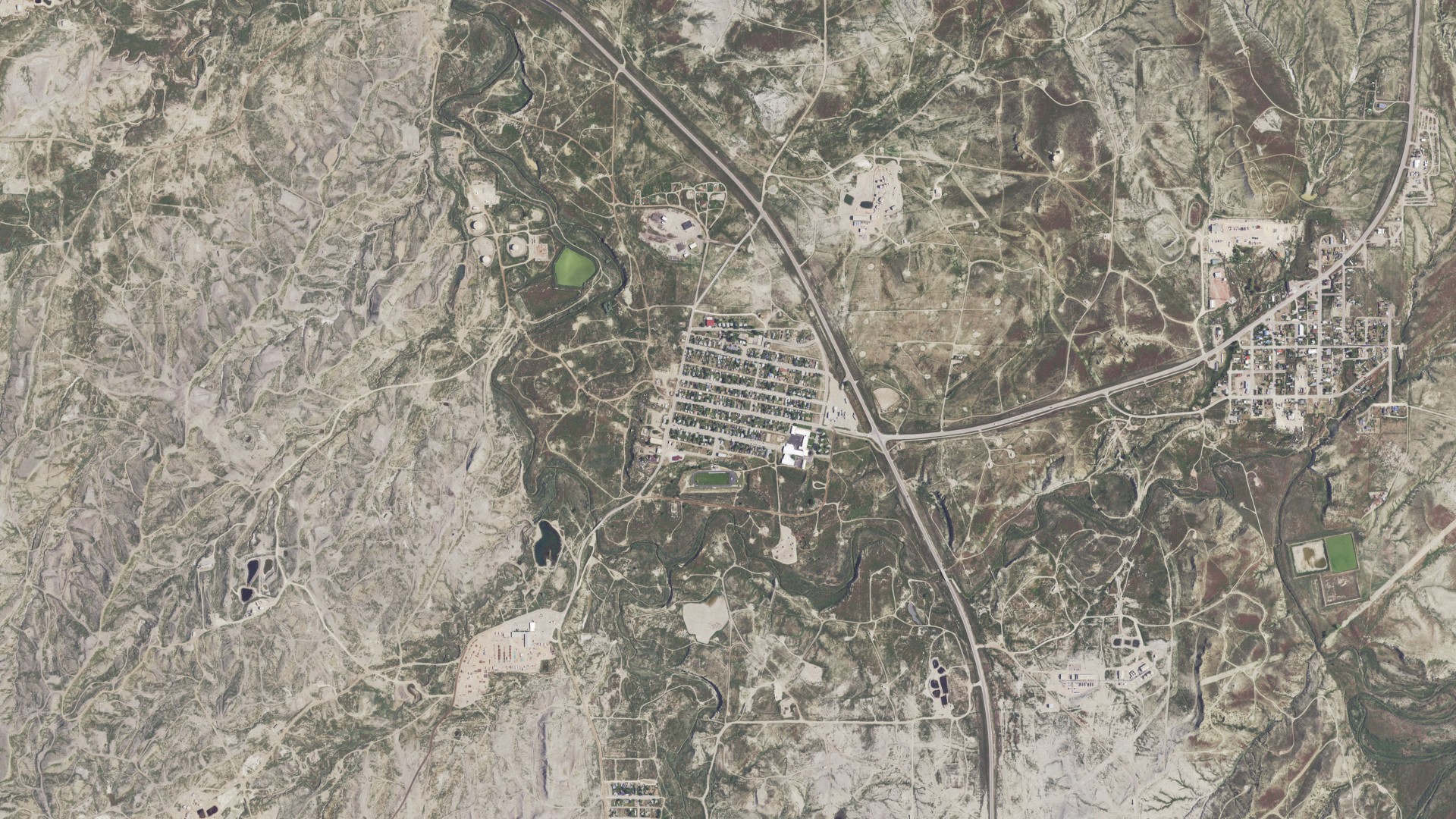 Natural-color aerial photograph of land around Midwest, Wyoming
